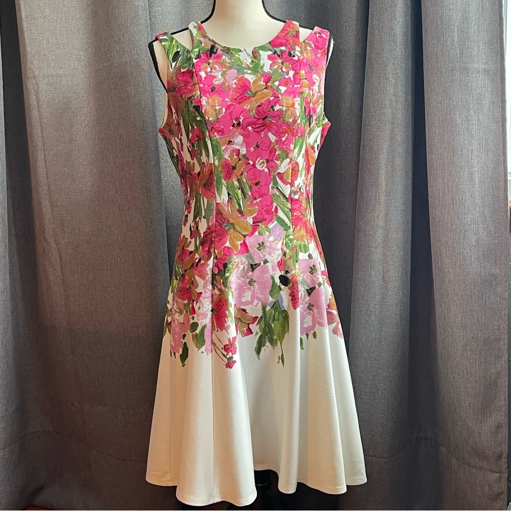 Sleeveless floral party dress. Fitted at waist and a Size 10